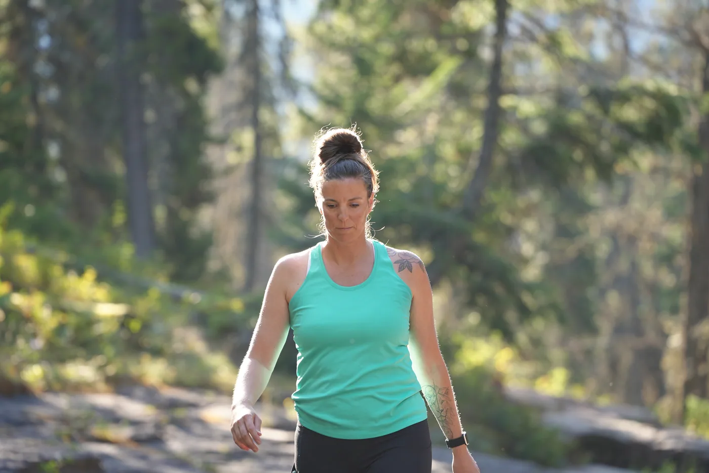 Woman hiking on a forest trail in Central Oregon